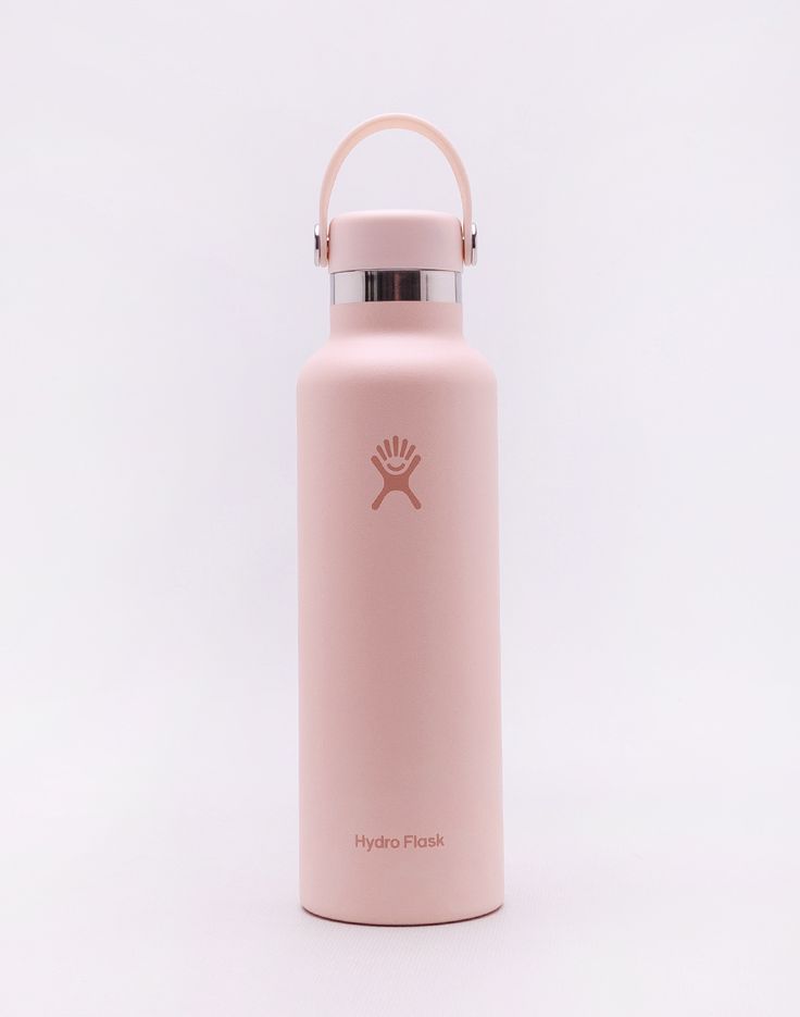 a pink hydro flask water bottle with a handle on the side and a white background