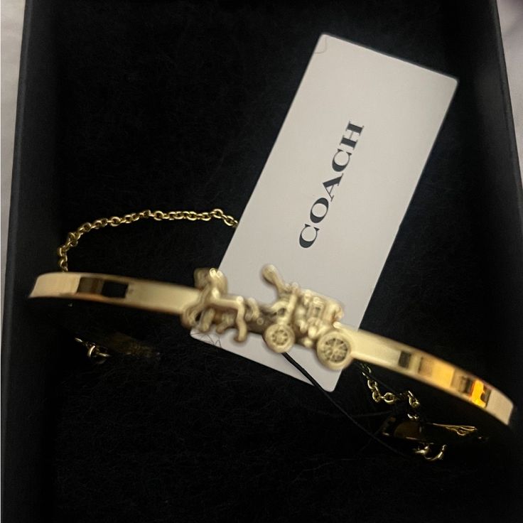 Brand New With Tags, Coach Bracelet. Absolutely Gorgeous. Elegant Coach Yellow Gold Jewelry, Elegant Coach Jewelry In Yellow Gold, Luxury Adjustable Bracelet By Coach, Luxury Adjustable Coach Bracelets, Luxury Adjustable Coach Bracelet, Luxury Adjustable Coach Jewelry, Coach Gold Bangle Bracelet, Classic Coach Jewelry For Gifts, Coach Bangle Bracelets Gift