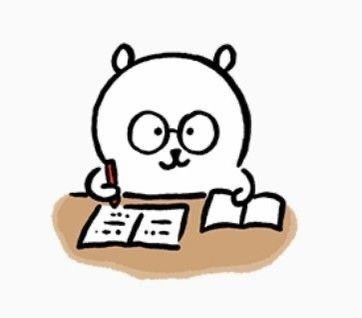 a cartoon bear sitting at a desk writing on paper