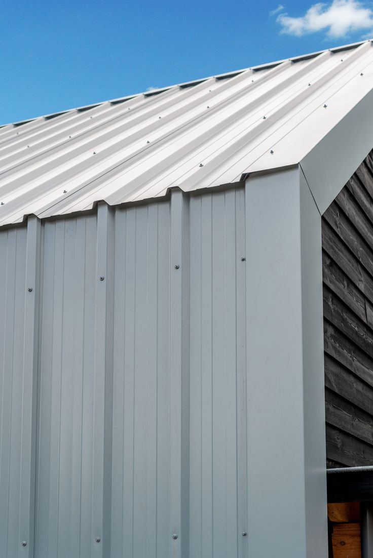 a metal roof on top of a wooden building