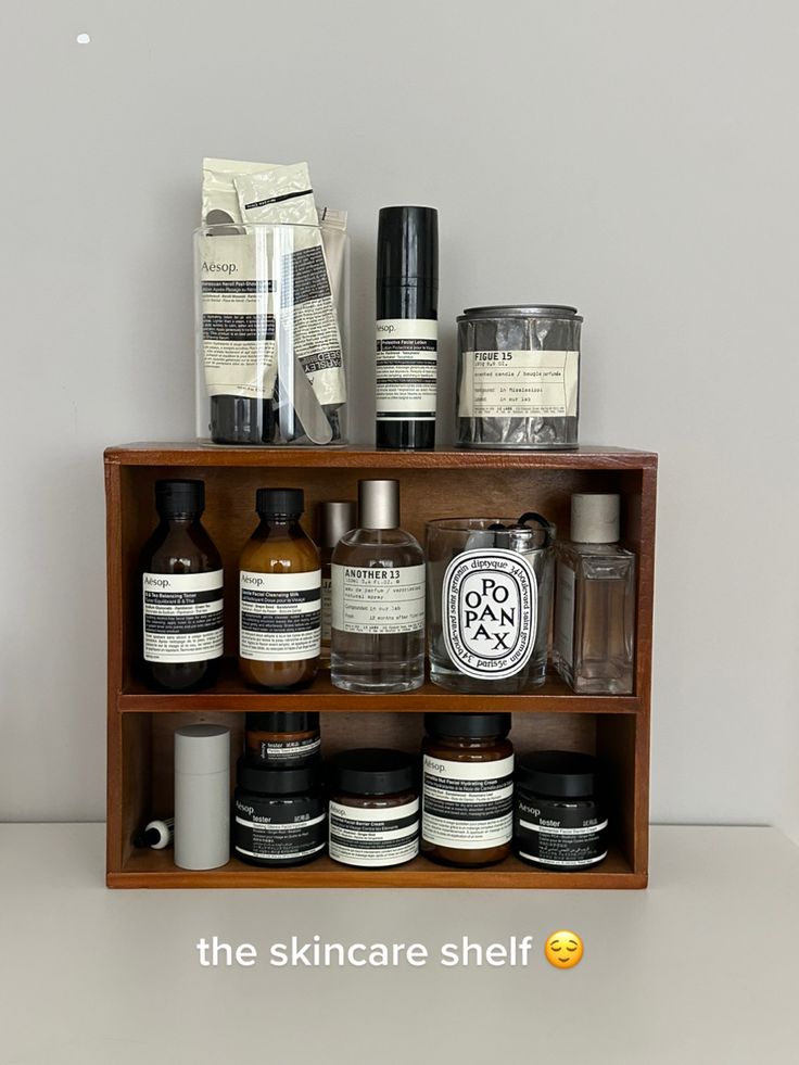 a wooden shelf filled with different types of skin care products