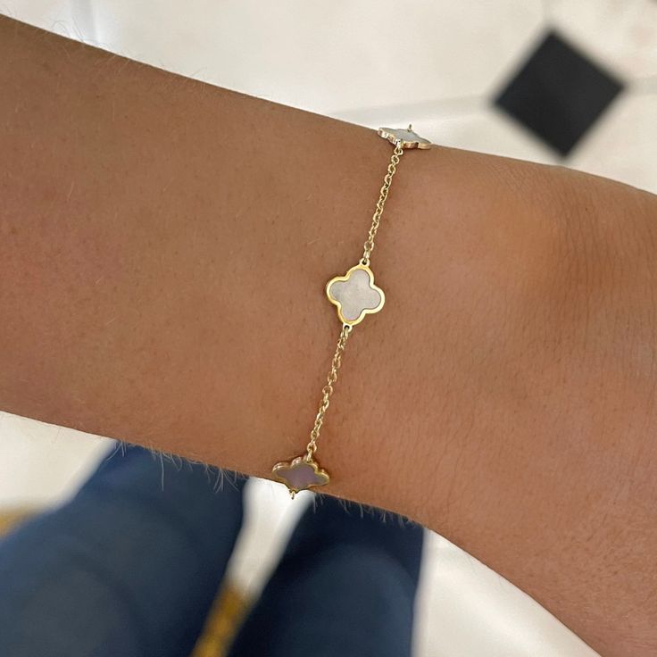 We know you'll adore the Mother of Pearl Clover Bracelet! This piece can be flawlessly paired with any other bracelet, or stand alone for a simple yet striking statement. Metal: 14k Yellow Gold 5 Mother of pearl clovers Length: 7 inches Closure: Lobster clasp Also available in Turquoise or pink Looking for a different size? Please email us. College Rings, Station Bracelet, Resize Ring, Clover Bracelet, Mens Engagement, Band Bracelet, Tennis Necklace, Mens Band, Ring Fit