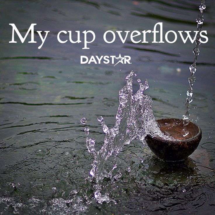 a wooden bowl with water coming out of it and the words, my cup overflows