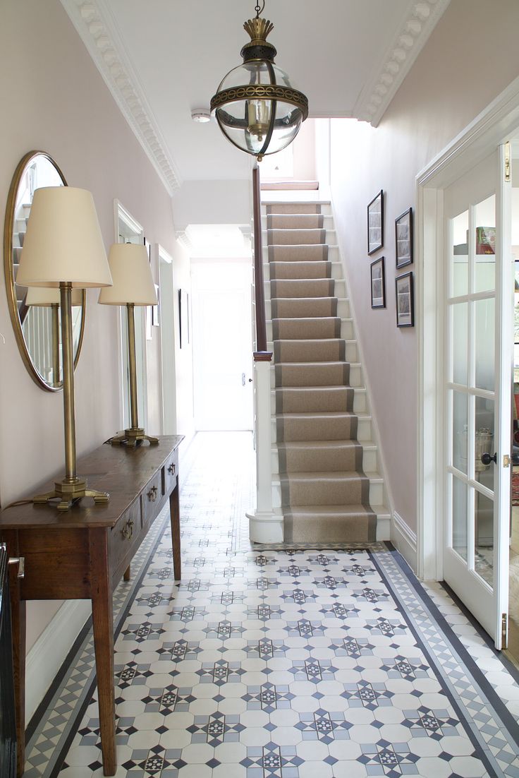 the hallway is clean and ready for us to use as an entrance way in this house