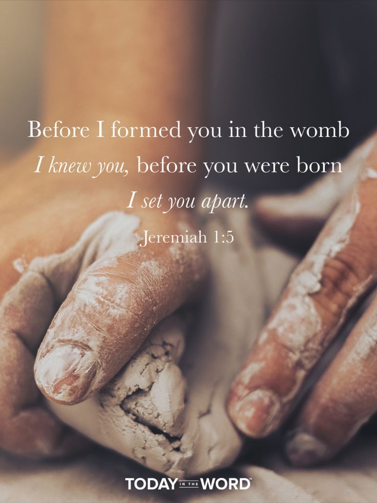 a person's hands covered in mud with the words, before i formed you in the word i knew you, before you were born