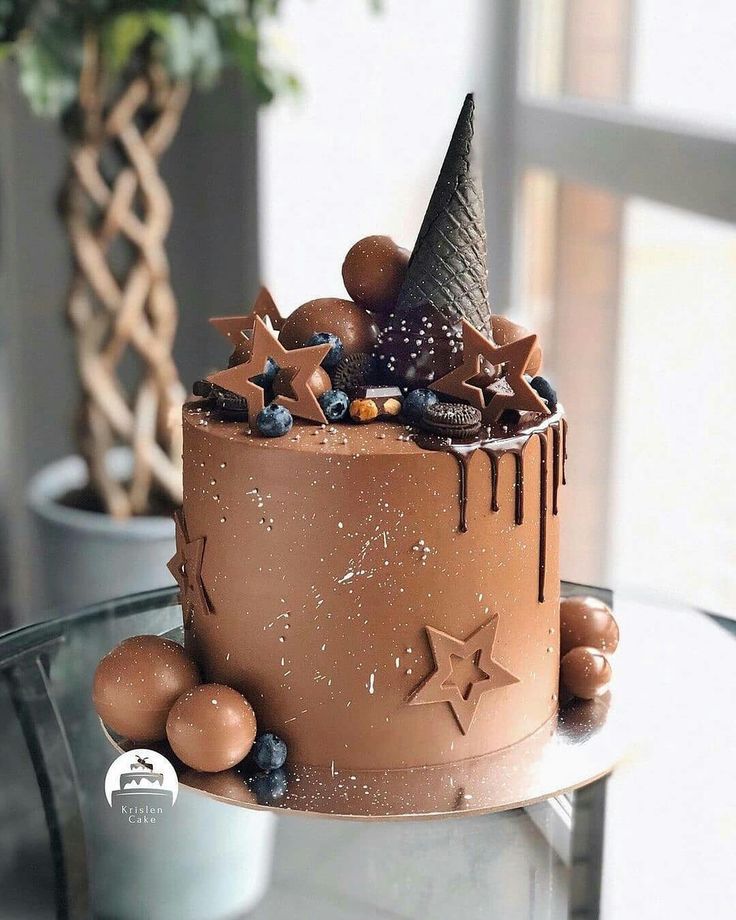 a chocolate cake decorated with stars and decorations