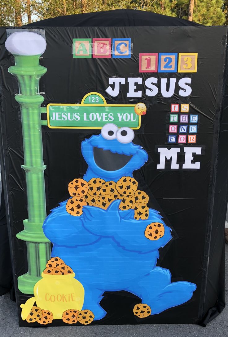 the sesame street sign is decorated with cookies and cheetos for jesus loves you