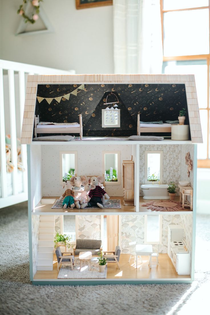 a doll house with furniture and decorations inside