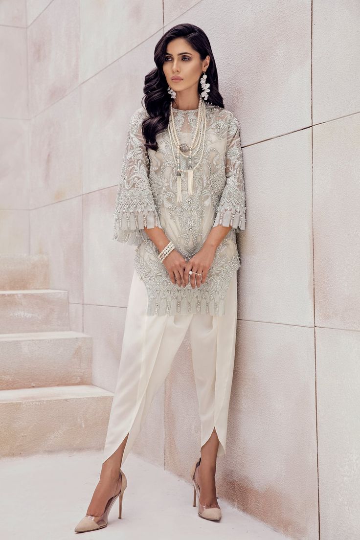 From the Luxury Pret '18 collection, this gorgeous number is unique and fun. A shirt with symmetrical cuts on each side paired with a tulip shalwar. 3 pieces. Elegant Festive Pant Set For Reception, Elegant Pant Set With Resham Embroidery, Festive Party Sets With Set-in Sleeves, Elegant Pant Set For Reception With Long Sleeves, Elegant Long Sleeve Pant Set For Reception, Elegant Pant Set With Resham Embroidery For Eid, Elegant Resham Embroidery Pant Set For Eid, Elegant Pant Set For Wedding And Eid, Elegant Pant Set With Resham Embroidery For Party