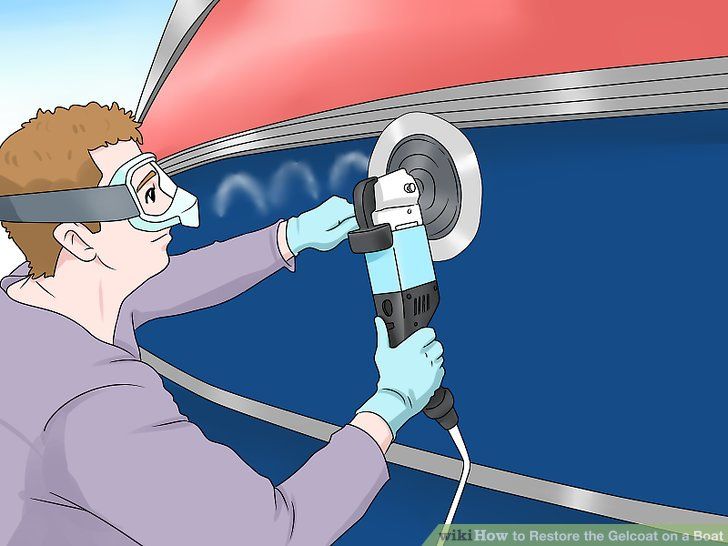 a man working on a car with an electric tool