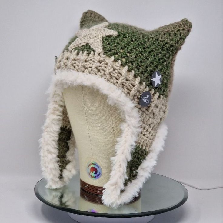 a knitted hat on top of a glass plate