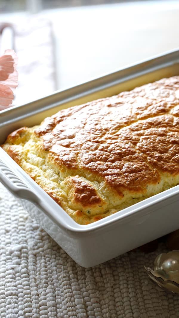 a casserole dish with bread in it on a table