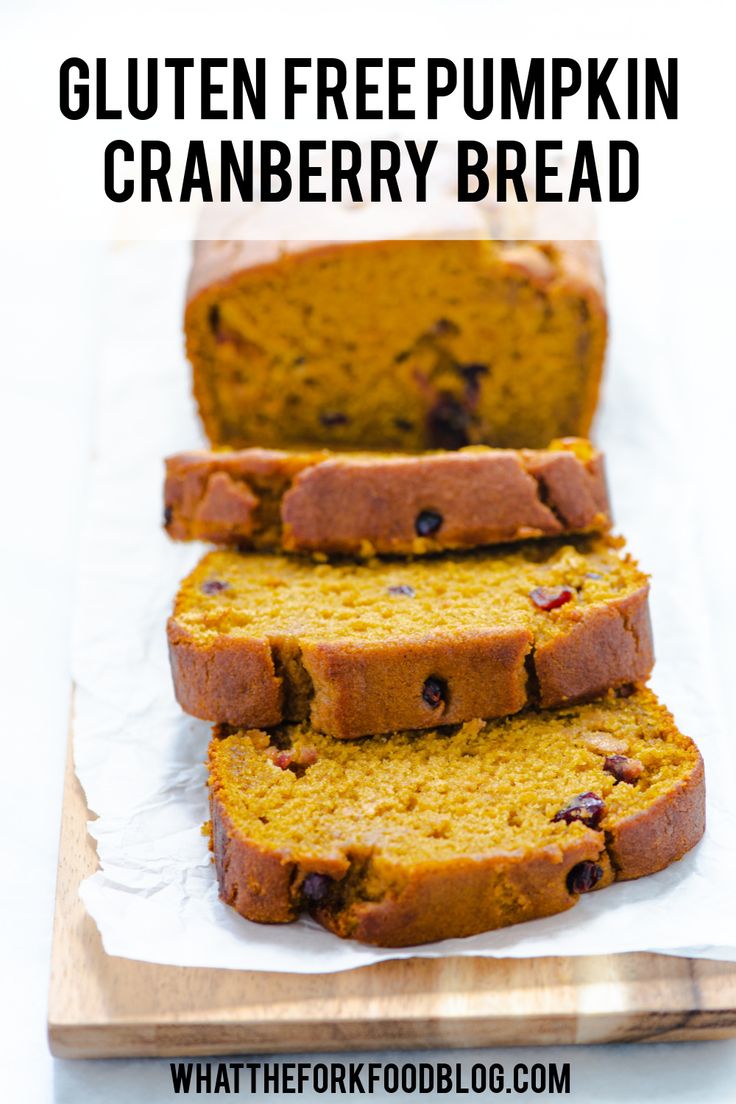 gluten free pumpkin cranberry bread on a cutting board with text overlay