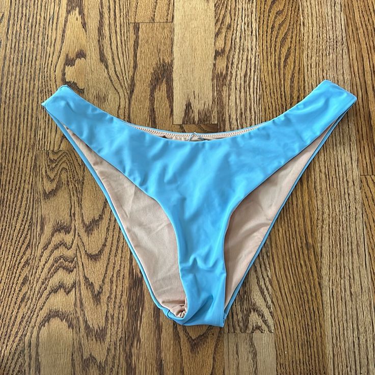 Washed But Never Worn! Excellent Condition And Size Medium! Stretch Blue Beachy Bottoms, Trendy Blue Swimwear, Trendy Blue Stretch Swimwear, Trendy Blue Swimwear For Pool, Trendy Blue Swimwear For Sunbathing, Trendy Light Blue Swimwear For The Beach, Trendy Light Blue Swimwear For Beach, Blue Stretch Beachy Swimwear, Trendy Blue Swimwear For Poolside