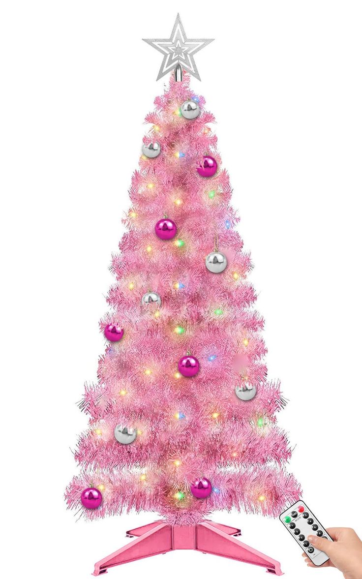 a pink christmas tree with lights and remote control