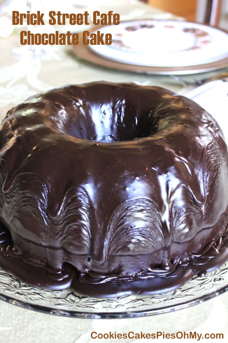 a chocolate cake sitting on top of a glass plate