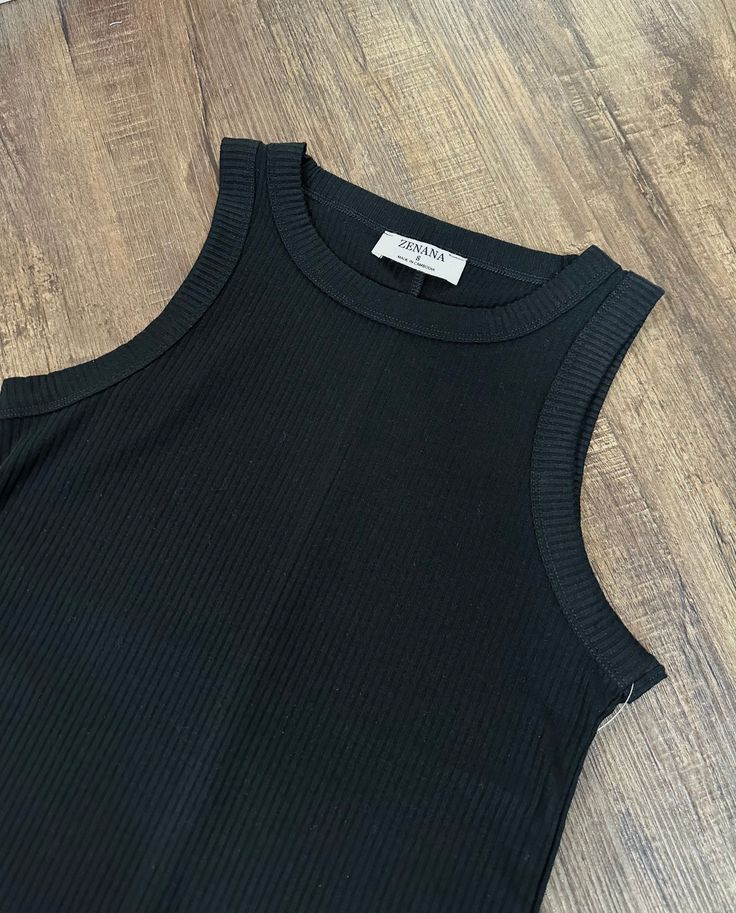 Perfect for layering or wearing by itself, this black ribbed tank top is a neccessity for every closet! Wear these tanks under dresses, cardigans, shackets or flannels or even by itself! Color: Black Ribbed Tank Top Fabric 62% Polyester 33% Rayon 5% Spandex Fall Candle Decor, Athletic Skirts, Kids Beanies, Ribbed Tank Top, Vests Mens, Under Dress, Ribbed Tank Tops, Ribbed Tank, Top Fabric