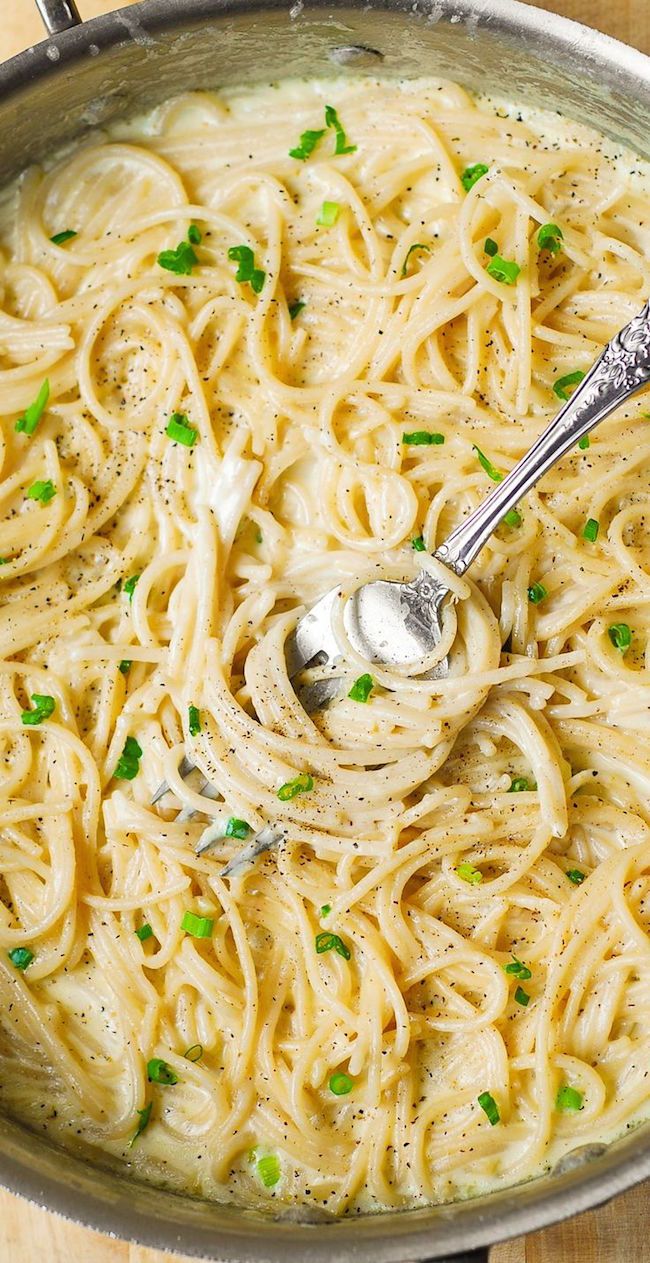 a large pot filled with pasta and peas