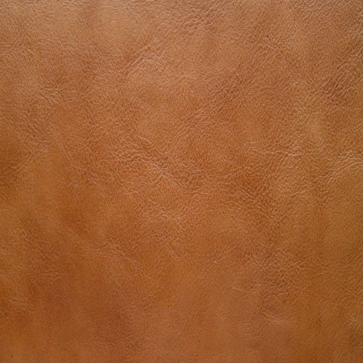 a close up view of a brown leather texture