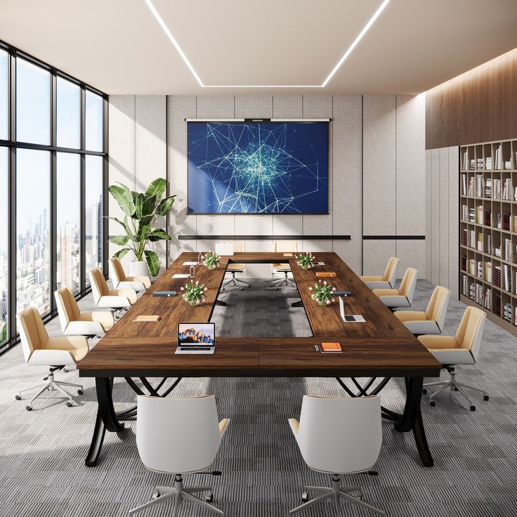 a large conference table with chairs around it and a flat screen tv on the wall