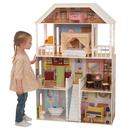 A classic dollhouse with southern flair, the KidKraft Savannah Dollhouse stands over four feet tall and features four levels of imaginative fun with six rooms and two balconies. A center staircase welcomes dolls into the home. There are cozy dcor touches throughout. Notice the tiered pink cakea sign of a perfect hostess. The included 14-piece accessory pack features exquisitely detailed, hand-painted furniture to fit 12-inch fashion dolls. The doors on the kitchen refrigerator and oven really op Kidkraft Dollhouse, Dreamhouse Barbie, Girls Playhouse, Kids Doll House, Wooden Dollhouse, Barbie Dream House, Barbie House, Barbie Dream, Barbie Furniture