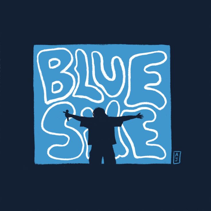 a man standing in front of a blue square with the words blue sale on it