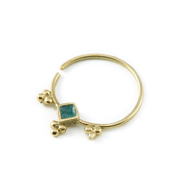 a gold ring with blue stones on it