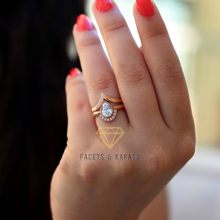 Unique one of a kind Pear Shaped Engagement Ring Bridal Set with V Shaped Nesting Chevron Wedding Band in Solid 14k Real Rose Gold, Alternative Wedding Rings. Hand crafted in solid 14k rose gold, this bohemian style, pear shaped engagement ring and V shaped wedding band is unique in every sense. Set in a gorgeous hand carved beaded bezel, the center pear shaped amorphous diamond is of the highest quality with a color grade of D and clarity grade of VVS1. A truly one of a kind ring for a truly on Pear-shaped Diamond Cut Wedding Rings, Wedding Stackable Rose Gold Diamond Rings, 14k Gold Wedding Jewelry With Halo Design, 14k Gold Wedding Rings With Halo Design, Wedding Pear-shaped Diamond Ring In 14k Gold, Pear-shaped Diamond White 14k Gold Wedding Ring, Heirloom Halo Design Wedding Jewelry, Heirloom Rose Gold Stackable Wedding Rings, Rose Gold Wedding Jewelry With Halo Design