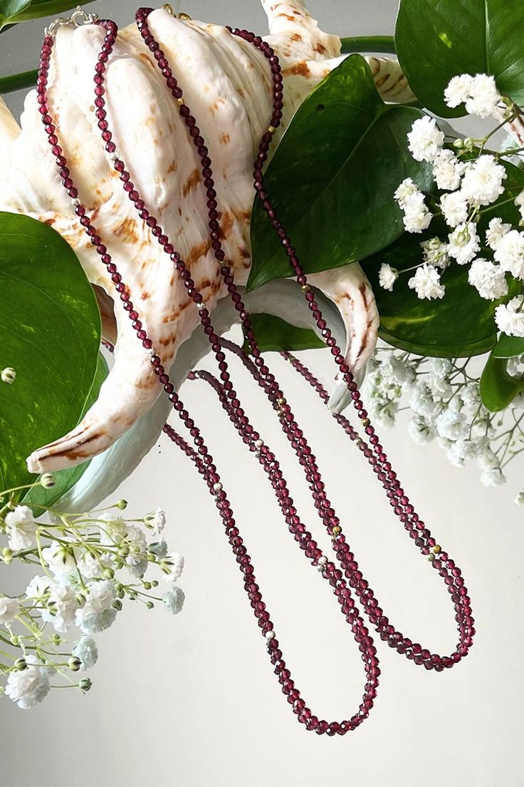 Classic and timeless, our Garnet gemstone beads necklace makes it easy to show off your individual style, while adding a pop of color to your everyday look. Mix and match with other gemstone necklaces, chains and charms to stylize your own personalized look! Garnet: Passion - Grounding - Kundalini Energy Necklace Length: 16" + 1" extender Gemstone Bead Size: 3 mm Cushion Cut Metal: Sterling Silver & 18K Gold Vermeil Spiritual Single Strand Crystal Necklaces With Round Beads, Spiritual Single Strand Crystal Necklace With Round Beads, Elegant Rondelle Crystal Necklace For Healing, Faceted Double Strand Beads As Gift, Faceted Double Strand Beads For Gift, Gemstone Beads Long Necklace Gift, Long Necklace With Round Gemstone Beads For Gift, Long Gemstone Beads Necklace As Gift, Gift Long Necklace With Round Gemstone Beads