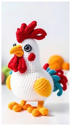 a crocheted chicken sitting on top of a table