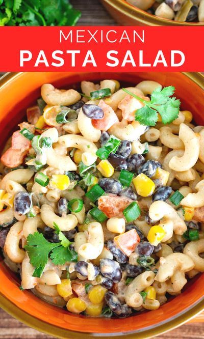 mexican pasta salad in an orange bowl with cilantro and black olives