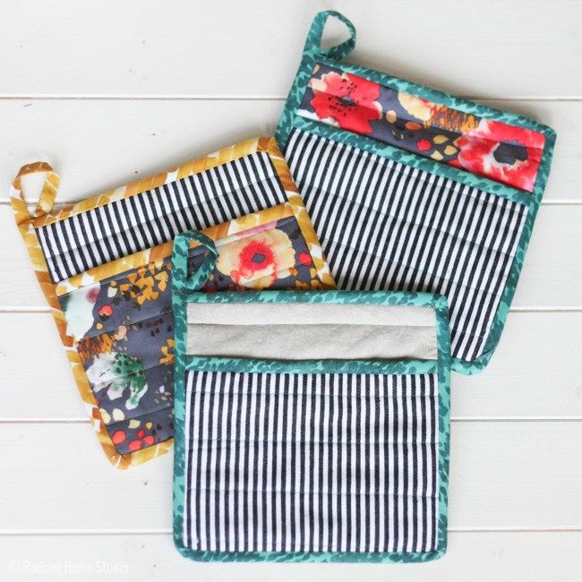 four placemats are lined up on a white surface with black and white stripes