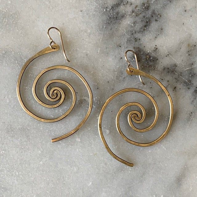 In these bronze or sterling silver plated earrings, the beauty of the universe intertwines with the artistry of the human hand. A crowd favorite, classic Lochlin Smith design. The larger sibling to our Spiral Galaxy Earrings. Length includes earwires. Earwires are 14/20 gold filled or sterling silver depending on color. Nickel Free Spiral Earrings For Everyday, Spiral Pierced Earrings As Gift, Spiral Pierced Earrings For Gift, Adjustable Brass Wrap Earrings Nickel Free, Modern Twist Spiral Wrap Earrings As Gift, Unique Hypoallergenic Brass Jewelry, Handmade Spiral Earrings For Everyday Wear, Unique Spiral Wrap Earrings As Gift, Unique Spiral Wrap Earrings For Gift