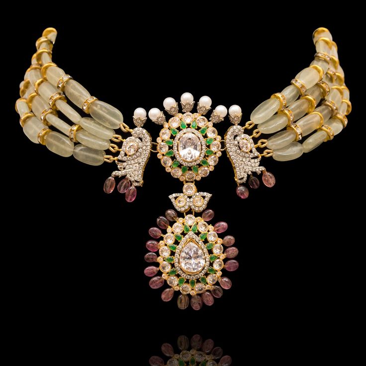 Crafted with precision and capturing the essence of blooming beauty, our Shifali Set is perfect for both casual and formal occasions! When elegance meets nature's charm, every detail sparkles with timeless allure. Adorned with dazzling CZ and emerald stones, white faux pearls, and real plum blossom tourmaline beads, this set exudes sophistication and grace. The set includes a necklace and a pair of matching earrings. Approximate earrings length is 3". Gold-plated on high-quality brass as the bas Elegant Kundan Hand-set Necklace For Reception, Elegant Hand-set Kundan Necklace For Reception, Elegant Hand Set Kundan Necklace For Reception, Elegant Bridal Necklace With Stone Work For Receptions, Elegant Jeweled Bridal Necklace For Reception, Elegant Kundan Necklace With Stone Work For Reception, Elegant Jeweled Kundan Necklace For Wedding, Elegant Bridal Necklace With Stone Work, Luxury Stone Work Bridal Necklace For Reception