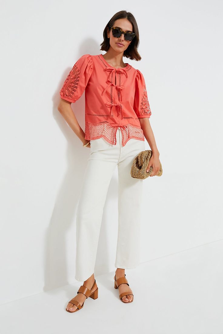 Founded by brothers in 1998 on Martha's Vineyard, Vineyard Vines creates both casual and dressy styles for men and women.The Just Peachy Cotton Eyelet Top is a standout style of the season, with its chic eyelet details, slight puff sleeve and adjustable ties. We love to style it with high waisted shorts and sandals for an elevated everyday look, with denim and sneakers for casual comfort, or with trousers and loafers for an office outfit. Round neck Short puff sleeves Four self-ties on front Sca Trendy Orange Spring Blouse, Trendy Orange Blouse For Spring, Feminine Spring Blouse For Casual Gatherings, Feminine Blouse For Casual Spring Gatherings, Casual Summer Blouse For Gatherings, Casual Summer Blouse For Casual Gatherings, White Spring Blouse For Casual Gatherings, Chic Orange Cotton Blouse, Chic Spring Cotton Blouse