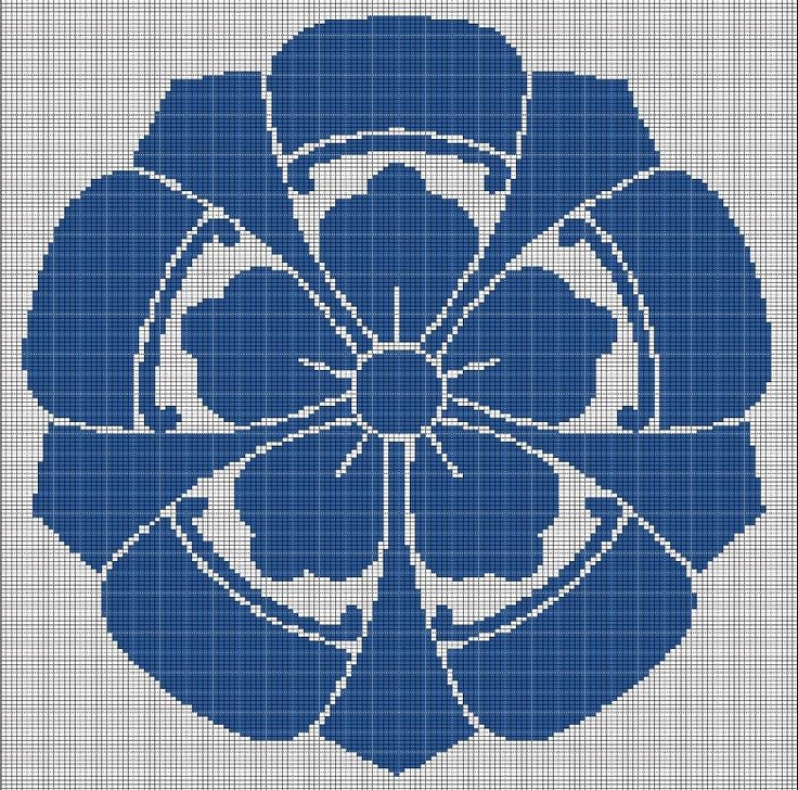 a blue flower with four petals in the center on a cross stitch pattern for a wall hanging