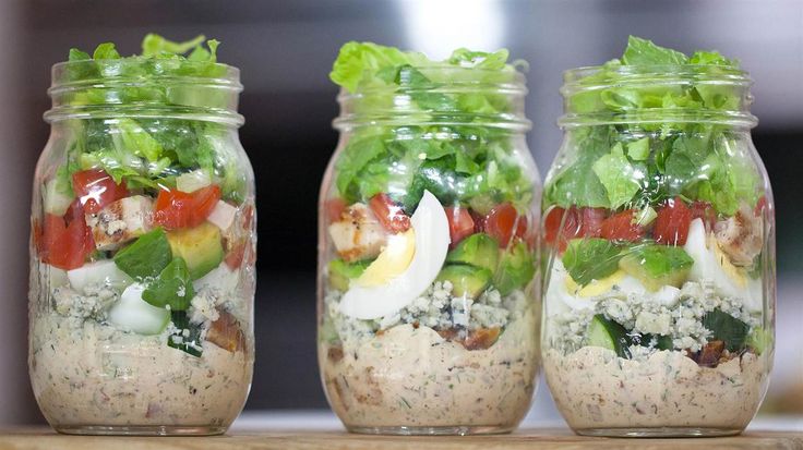 three mason jars filled with different types of food