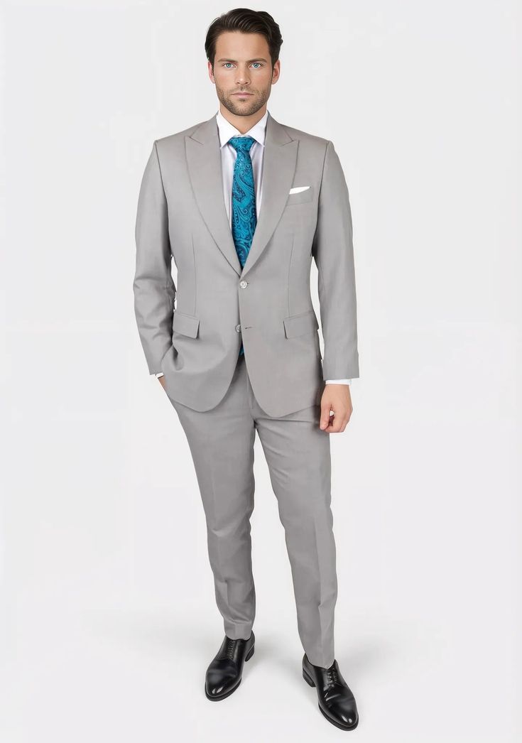 Discover timeless elegance with the Thompson Harbor Grey Suit. Featuring a classic grey with a hint of color in a sharkskin weave, this luxury, custom-made suit is a fashion-forward bespoke piece perfect for making a sophisticated impression. Feel exclusive in this tailored work of art. Tailored Gray Three-piece Suit With Suit Collar, Tailored Gray Tuxedo In Suiting Fabric, Gray Tuxedo Suit For Formal Occasions, Tailored Gray Tuxedo For Formal Occasions, Gray Tailored Tuxedo Suit, Semi-formal Gray Tuxedo With Notch Lapel, Gray Notch Lapel Tuxedo For Semi-formal Events, Gray Notch Lapel Tuxedo For Semi-formal Occasions, Fitted Gray Double Breasted Suit