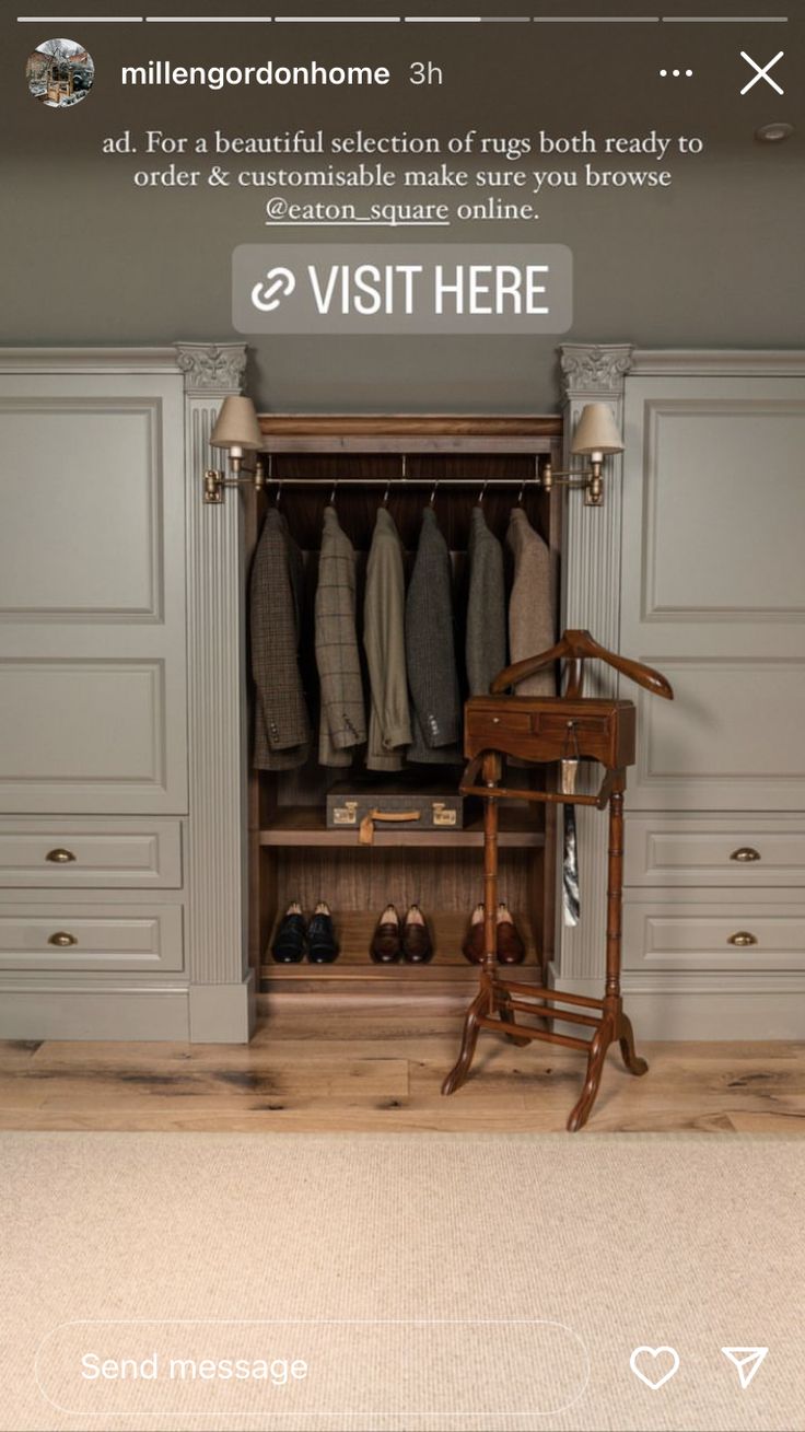 an open closet with clothes hanging on the wall