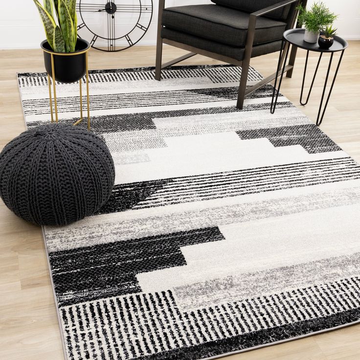 a black and white area rug in a living room