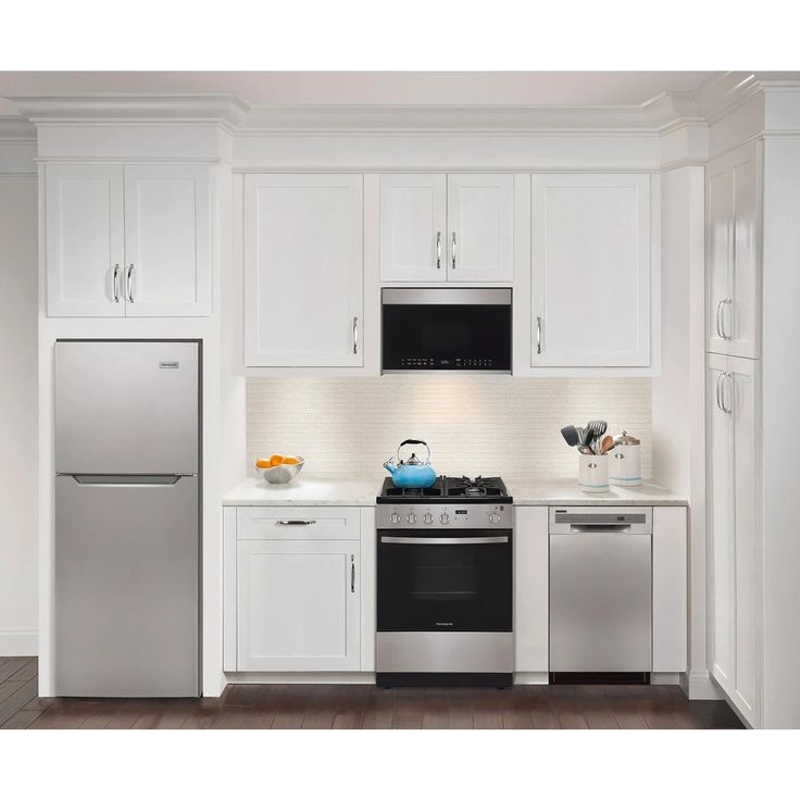 a kitchen with white cabinets and stainless steel appliances, including a dishwasher, refrigerator, microwave, stove and oven