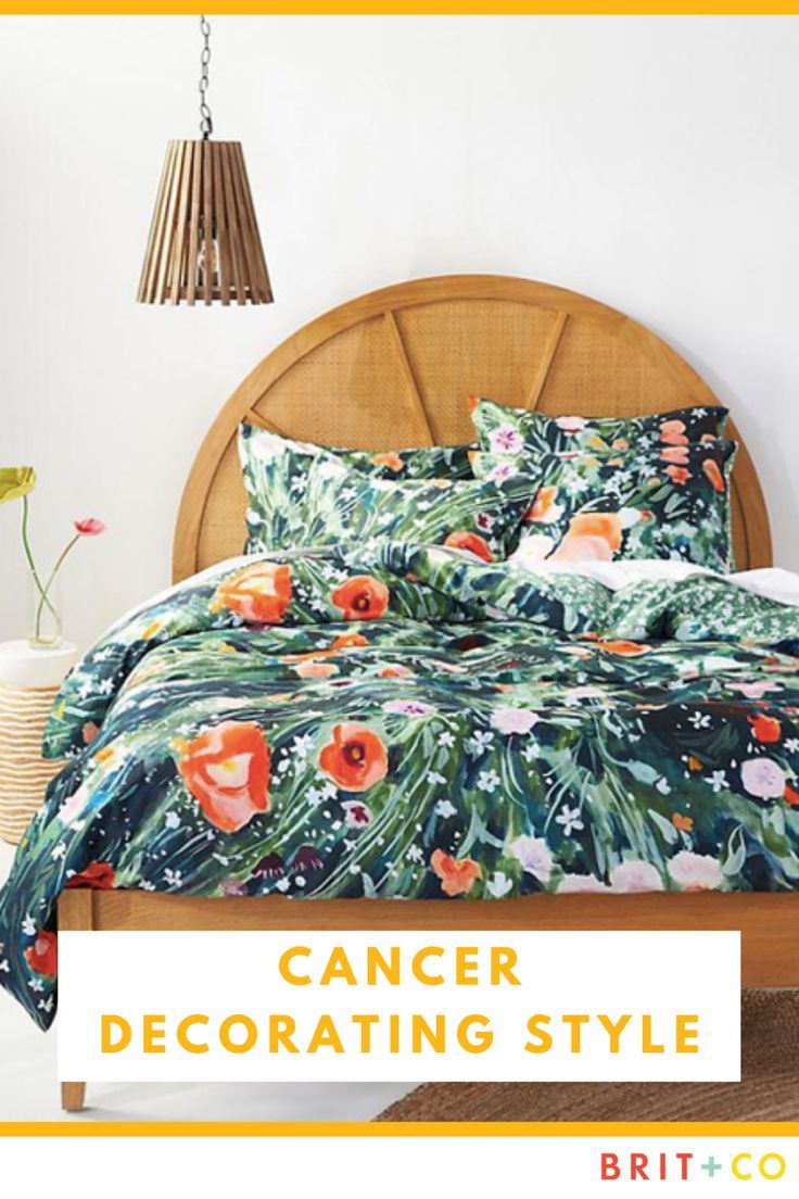 a bed room with a neatly made bed and flowers on the comforter, next to a lamp