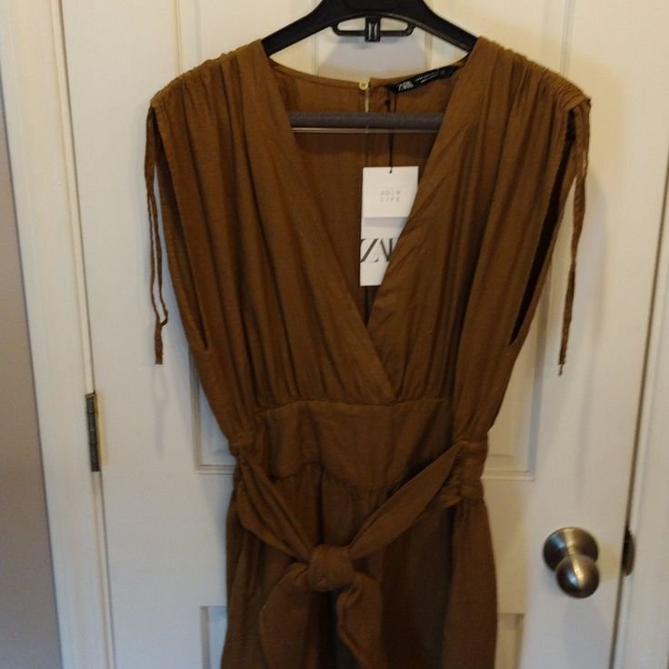 Zara Romper. New With Tags. Has Small Discoloration In Fabric On Back Side See Photos. Spring Brown V-neck Jumpsuits And Rompers, Chic Brown Jumpsuits And Rompers For Spring, Brown V-neck Jumpsuits And Rompers For Spring, Spring Brown V-neck Jumpsuit, Zara V-neck Jumpsuits And Rompers For Day Out, Zara Jumpsuit, Zara Pants, On Back, See Photo