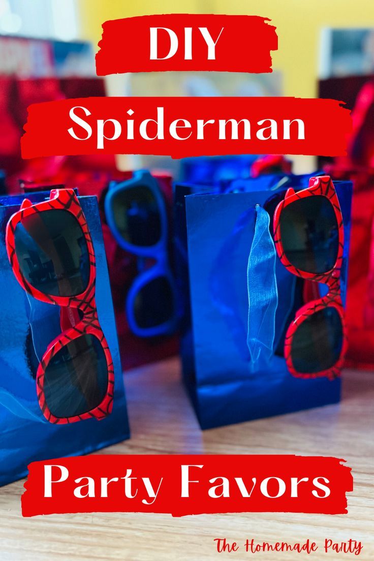 two blue bags with red spiderman party favors in them and the words diy spiderman party favors