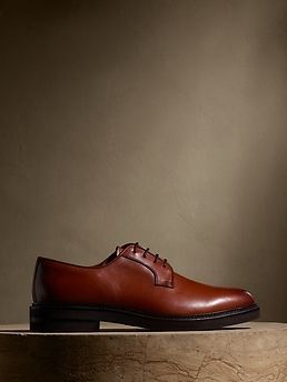 A modern classic, this sleek, streamlined take on the classic leather oxford shoe lets its beautiful craftsmanship shine.  Leather uppers.  Waxed laces.  Leather soles.  Made in Portugal.  #574354 Whole and half sizes. Timeless Oxford Material Oxfords For Business Casual, Timeless Oxfords For Business Casual, Timeless Oxford Lace-up Shoes For Derby, Classic Lace-up Shoes With Stitched Sole For Business, Timeless Business Casual Derby Shoes, Classic Goodyear Welted Lace-up Shoes For Business Casual, Timeless Almond Toe Oxfords For Business Casual, Classic Oxford Lace-up Shoes With Goodyear Welted, Classic Lace-up Oxford Shoes With Goodyear Welted