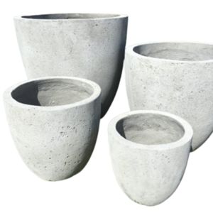 three cement pots sitting next to each other