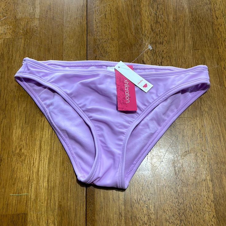 Swimwear: Bikini Bottom Brand: Xhilaration Color/Pattern: Purple Lavender Tag Size: Xs 00 Style: Cheeky Condition: Nwt. I Do Not See Any Flaws Lavender Stretch Swimwear For Beachwear, Lavender Stretch Swimwear For Beach Season, Purple Brief Swimwear For Vacation, Purple Stretch Swimwear Brief, Purple Stretch Brief Swimwear, Stretch Lavender Beach Bottoms, Stretch Lavender Bottoms For The Beach, Fitted Lavender Beach Bottoms, Trendy Stretch Purple Swimwear