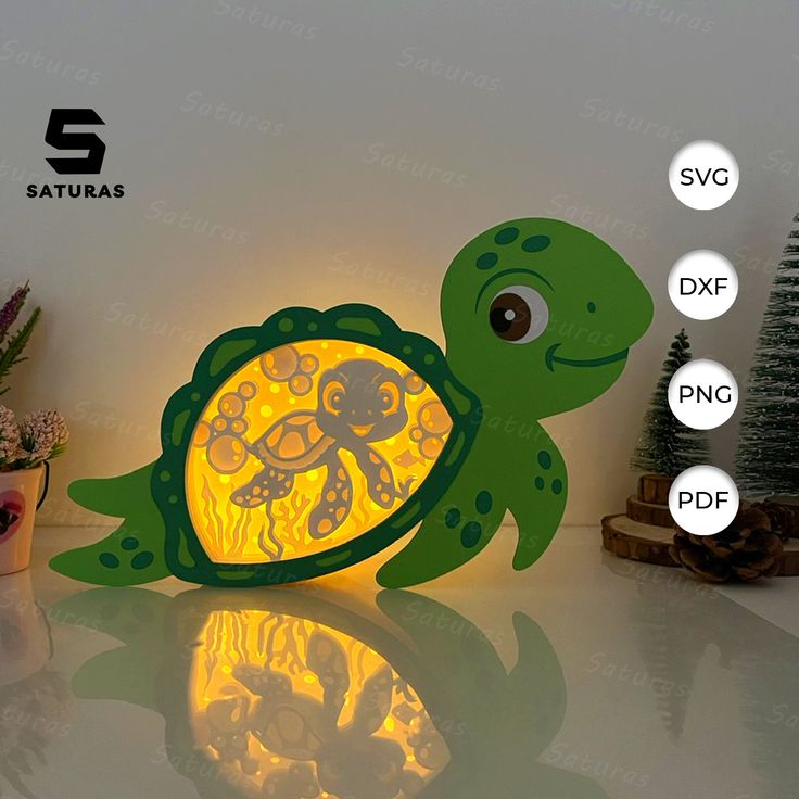 an image of a turtle night light that is on top of a table next to a potted plant