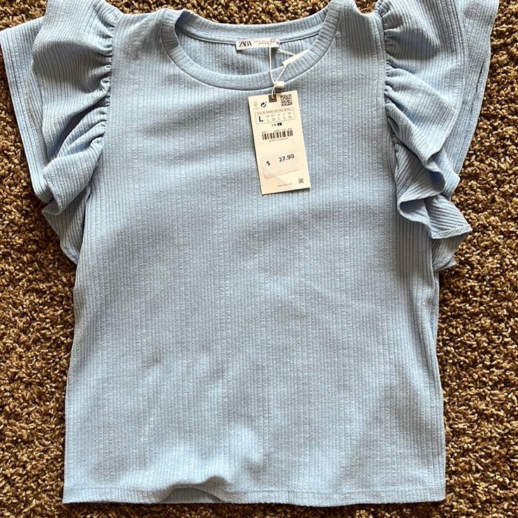 Baby Blue Zara Tee With Ruffle Sleeves With Tags Blue Stretch T-shirt For Summer, Blue Cotton T-shirt With Ruffles, Trendy Light Blue Spring T-shirt, Cute Stretch Tops For Spring, Cute Stretch T-shirt For Spring, Chic Blue T-shirt For Summer, Blue Casual Tops With Ruffle Sleeves, Blue Casual Ruffle Sleeve Tops, Stretch Casual T-shirt With Ruffle Sleeves