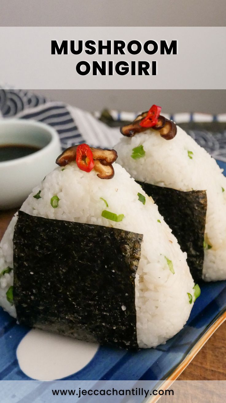 two pieces of sushi sitting on top of a blue plate